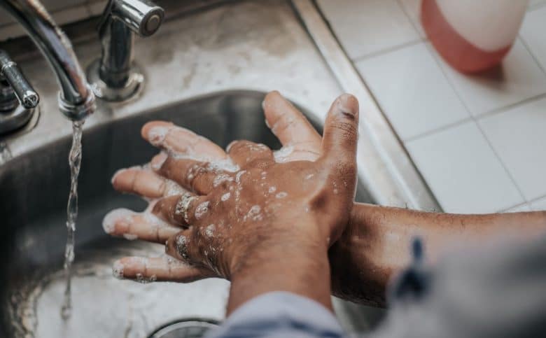 Man washing hands at a sink