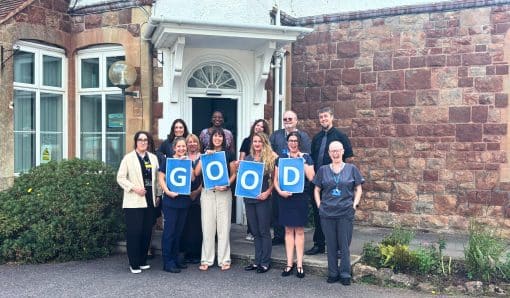 The Minehead Team Celebrate their 'Good' CQC Rating outside the practice.