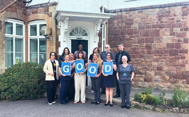 The Minehead Team Celebrate their 'Good' CQC Rating outside the practice.
